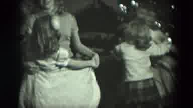 West Germany (1951): Four Girls Dancing And Smiling In Front Of The Christmas Tree