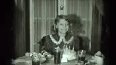 West Germany (1951): Happy Young Lady Smiling After Having Just Blown Out The
