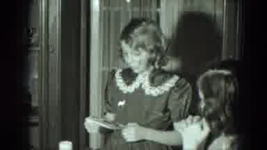 West Germany (1951): Girl Opens Gift Then Drops Book Onto Table While Trying To