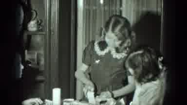 West Germany (1951): Young Girl Surrounded By Girls While Having Trouble Opening