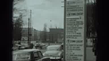 West Germany (1951): Busy City Intersection With Trolley Buses And Old-Fashioned