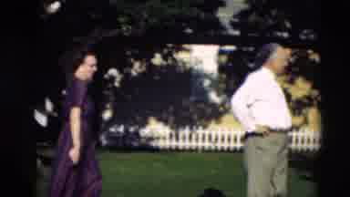 Paducah Kentucky USA (1951): Woman And Men Walk Across The Lawn To Meet Up And