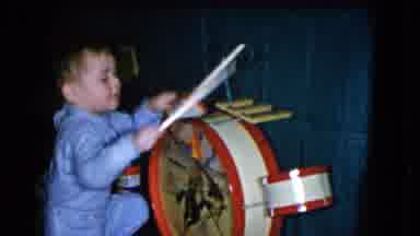 Cleveland Ohio (1951): Seated Boy Hitting Drum With Drumsticks Women With Glasses
