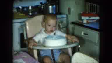 CLEVELAND OHIO-1951: Baby Boy Inspects Birthday Cake Before Sticking Thumb In