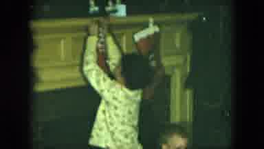 Cleveland Ohio (1951): Boy Wearing White Pajamas Hangs Stocking On Fireplace