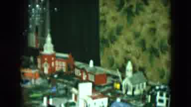 Cleveland Ohio (1951): Child Watches Toy Train Travel Around A Miniature City