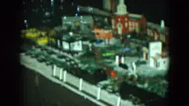 Cleveland Ohio (1951): Model Train Black Engine Yellow And Orange Cars Through
