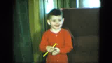 Cleveland Ohio (1951): Little Boy Wearing Red Shirt Holding A Yellow Stick Smiling