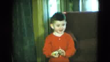 Cleveland Ohio (1951): Boy Wearing Red Shirt Smiles For Camera In Front Of Brown