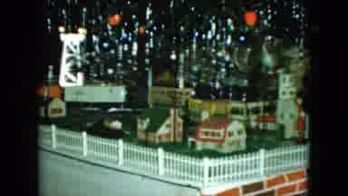 Cleveland Ohio (1951): Electric Train Set Moving Down Track Through Model Town