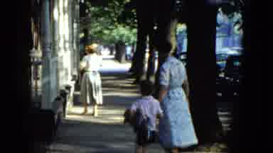 Cleveland Ohio (1951): Mothers And Kids Walking Down A Sidewalk On A Sunny Day