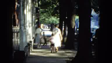 Cleveland Ohio (1951): Mother And Son Walking Down The Street And A Man Sweeping