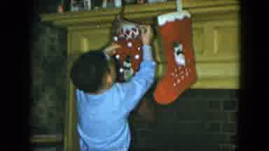 Cleveland Ohio-1951: Small Child Hanging Christmas Stockings With Care