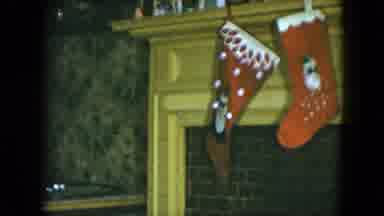 Cleveland Ohio (1951): Boy Wearing Blue Pajamas Hangs Red And White Christmas