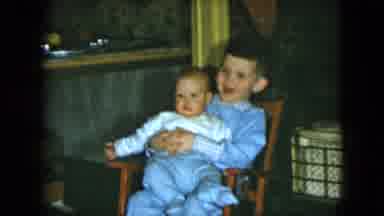 Cleveland Ohio (1951): The Baby Was Sitting On The Brother Lap Very Quietly