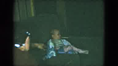 Cleveland Ohio (1951): Mother Shows Infant Toy After Child Opens Board Game