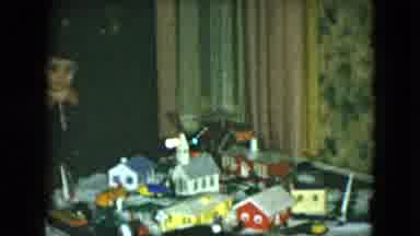 Cleveland Ohio (1951): Boy Watches Toy Train Travel Around Miniature Model Of City