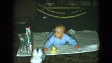 Cleveland Ohio (1951): Baby Laying On Blanket On The Floor Reaching For Toys Toy