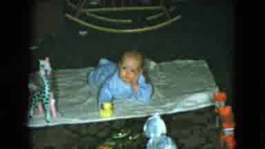 Cleveland Ohio (1951): Little Baby Playing And Watching A Moving Toy Car