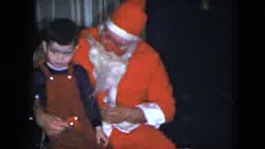 Cleveland Ohio (1951): Young Boy Sits On Santa's Lap But Won't Look At Him Is He