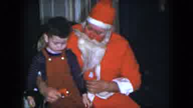 Cleveland Ohio (1951): Man Dressed As Santa Claus Holding And Talking To Young Boy