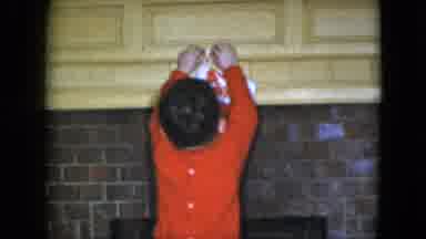 Cleveland Ohio (1951): Happy Little Boy Doing His Best Attempting To Hang A