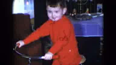 Cleveland Ohio (1951): A Baby Boy Who Is Looking Happy To Be Riding His Bicycle