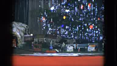 Cleveland Ohio (1951): Small Model Train Running Below A Revolving Christmas Tree