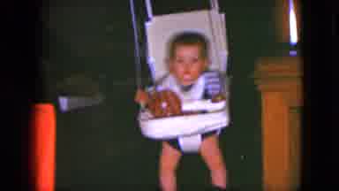 Cleveland Ohio (1951): Unimpressed Baby Swinging Back And Forth In House Doorway