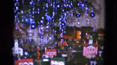 Cleveland Ohio (1951): Toy Train Running Through Toy Village Under Christmas Tree
