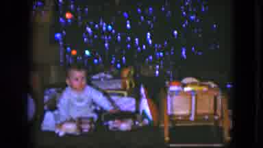 Cleveland Ohio (1951): Little Baby In Pajamas Sleepily Playing With Toys In Front