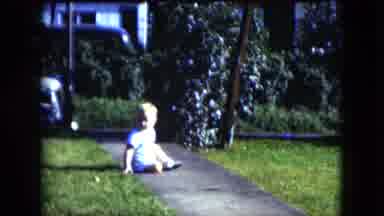 Cleveland Ohio (1951): Boy Child Attempts To Walk On Sidewalk To Reach His Parents