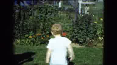 Cleveland Ohio (1951): A Toddler Walking And A Woman Blowing Bubbles To It