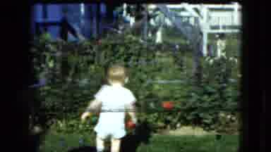 Cleveland Ohio (1951): A Little Boy Playing In The Garden With His Parents