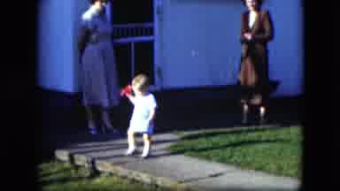 Cleveland Ohio (1951): Women Watching A Young Child Walking And Sitting On A