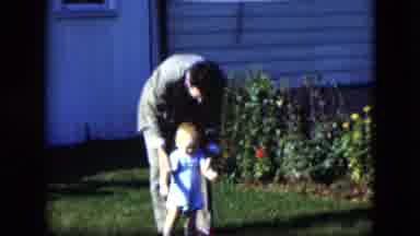 Cleveland Ohio (1951): Father And Child Playing With A Ball In The Yard