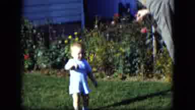 Cleveland Ohio (1951): Man On Green Nicely Manicured Lawn Waves To Young Child Who