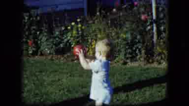 Cleveland Ohio (1951): Baby Wearing Blue Shorts Holds Red Ball While Toddler