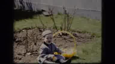 Cleveland Ohio (1951): Baby Sitting In The Yard Near The Garden Waving At A Camera