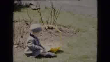 Cleveland Ohio (1951): Woman And Son In Grey Wool Trench Coats Walking On Grass