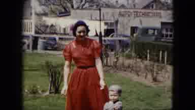 CLEVELAND OHIO-1951: Woman in Red Dress Walking with Child