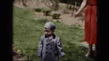 Cleveland Ohio (1951): A Little Boy Walking In The Garden With Their Parents