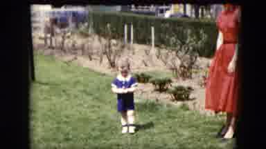 Cleveland Ohio (1951): Woman In Red Dress Watches Toddler Girl In Blue Dress Take