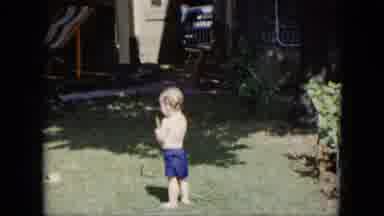 Cleveland Ohio (1951): A Little Boy Playing With Water In The Garden He Enjoy