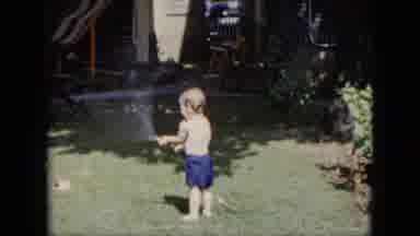 Cleveland Ohio (1951): Little Boy Squirting Himself In Face And Playing With Hose