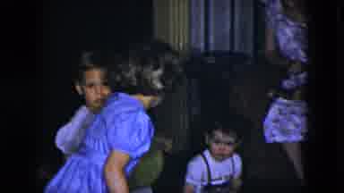 Cleveland Ohio (1951): Children Hold Toys And Balloons While Sitting On Floor