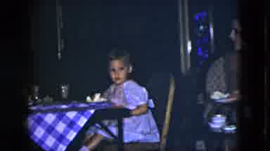 Cleveland Ohio (1951): A Child Sitting In A Chair While At A Table