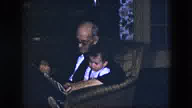Cleveland Ohio (1951): Grandfather Reading To His Grandchild