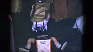 Cleveland Ohio (1951): Young Child Removing Wrapping Paper From Present And