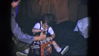 Cleveland Ohio (1951): A Little Girl Opening Up A Toy From Parents